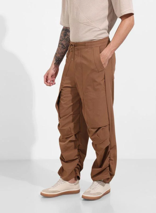 The Indian Garage Co  Men Baggy Fit Solid Cross Pocket Mid-Rise Trousers for Men | Best Price UAE